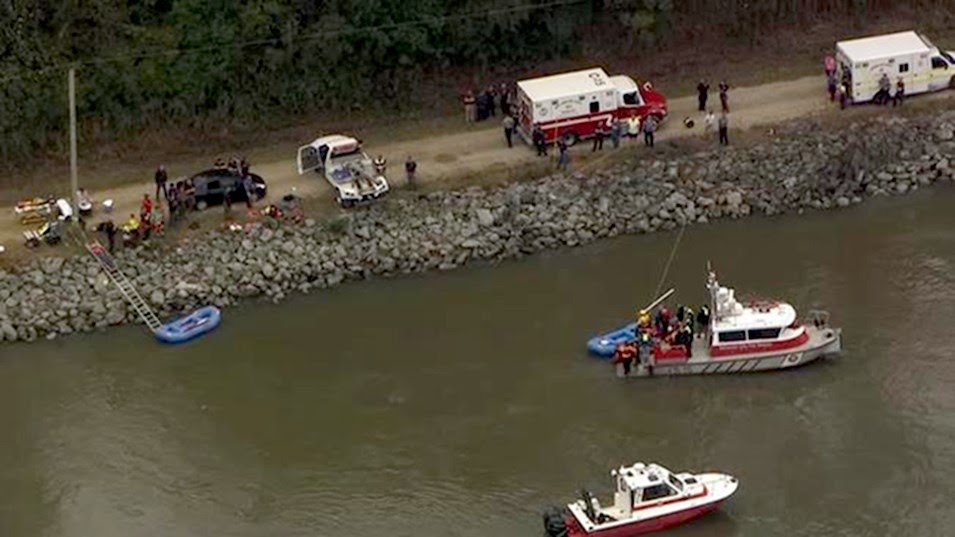 Driver dies trying to rescue passengers from submerged car; two others found dead