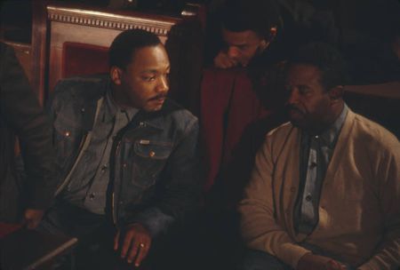 Martin Luther King, Jr., Ralph Abernathy, and Andrew Young sitting behind the podium during a meeting at Tabernacle Baptist Church in Birmingham, Alabama in 1967.