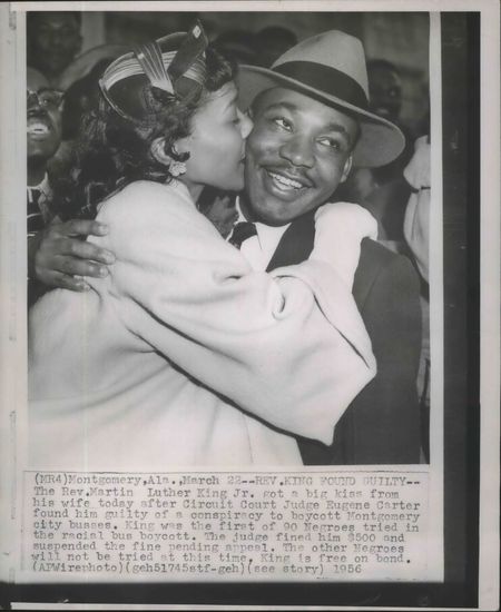 Coretta Scott King gives her husband Martin Luther King Jr. a kiss.